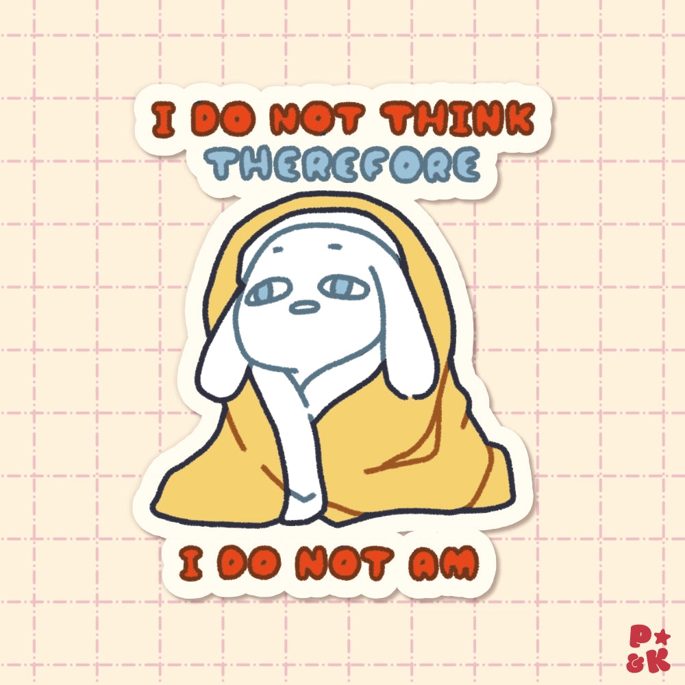 A die-cut sticker featuring a cute cartoon rabbit wrapped in a yellow blanket, with the text 'I DO NOT THINK THEREFORE' at the top and 'I DO NOT AM' at the bottom, shown on a pale pink grid background.