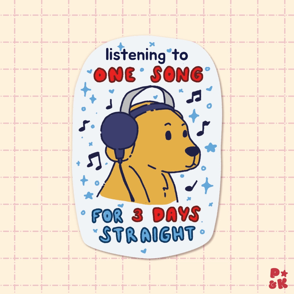 A die-cut sticker featuring a cartoon bear wearing headphones and a baseball cap, surrounded by musical notes and stars. The text reads 'listening to ONE SONG FOR 3 DAYS STRAIGHT' in blue and red lettering.