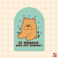 A die-cut sticker featuring a cute cartoon bearin a pet-shaped outline on a mint green background, with the text 'IF DEADLY WHY PET SHAPED?' below it. The sticker is displayed on a light pink grid-patterned background.