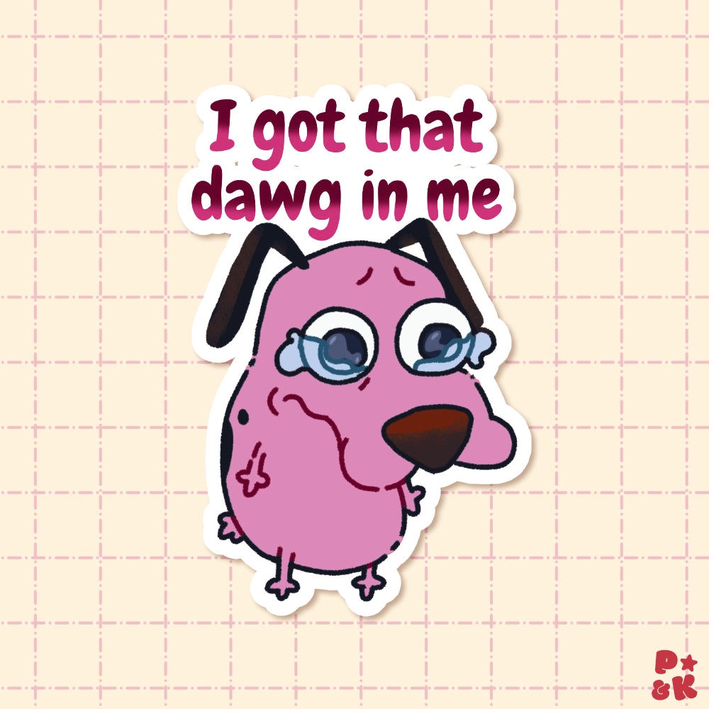 A die-cut sticker featuring a pink cartoon dog with tears and the text 'I got that dawg in me' above it, shown on a pale pink grid background.