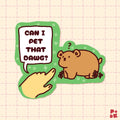 A die-cut cartoon sticker featuring a brown bear and a pointing hand with the text 'CAN I PET THAT DAWG?' on a pale pink grid background.