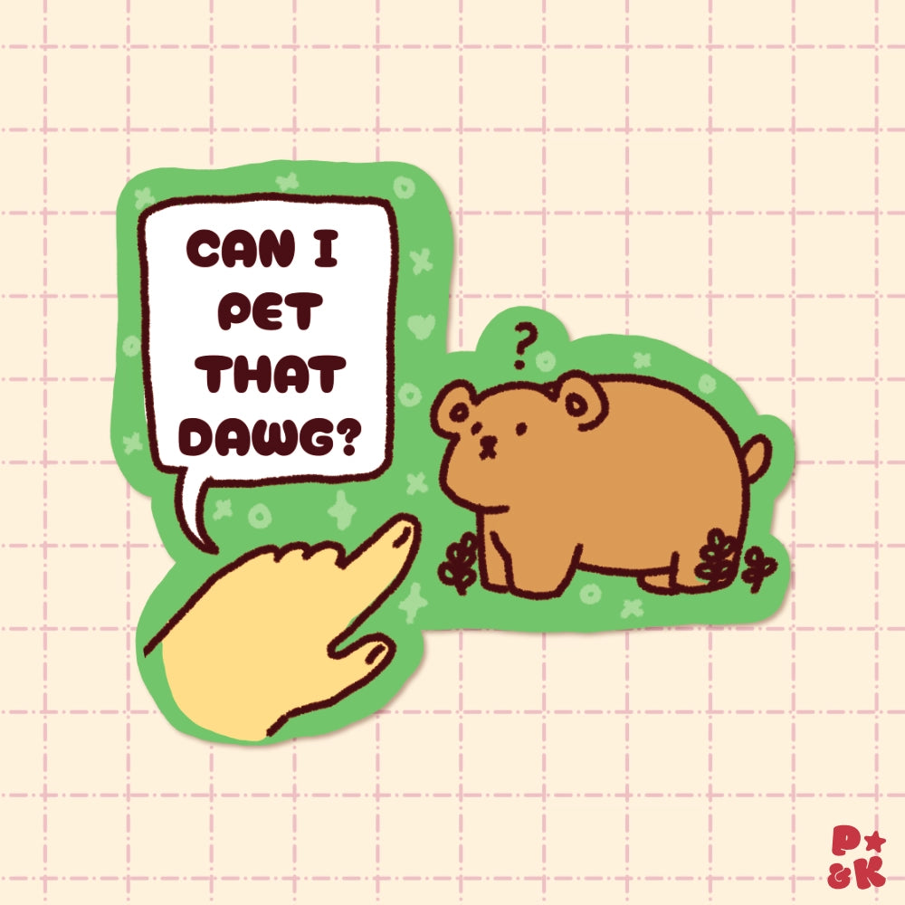 A die-cut cartoon sticker featuring a brown bear and a pointing hand with the text 'CAN I PET THAT DAWG?' on a pale pink grid background.