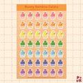 A sheet of bunny-themed gelato stickers on a peach grid background. The stickers feature bunnies in pastel rainbow colors served in gelato in gingham patterned paper cups with the header reading 'Bunny Rainbow Gelato' and 'Waterproof Vinyl Stickers.